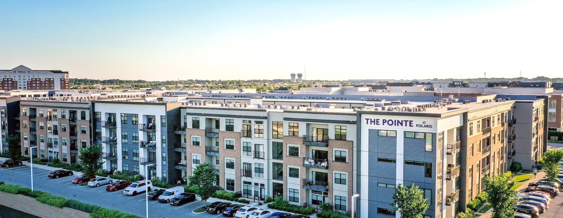 a building with cars parked in front